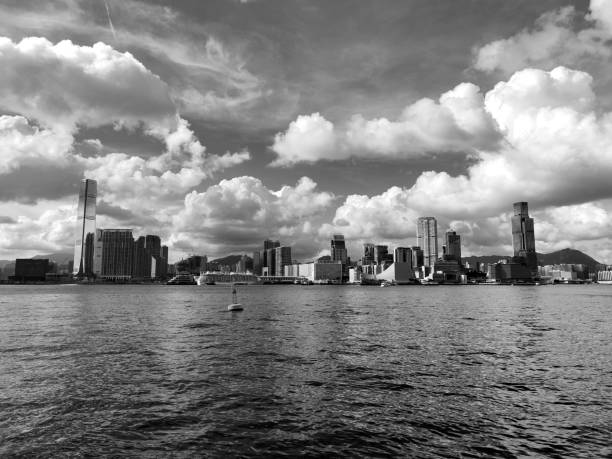 Clouds over Kowloon peninsula skyline on Victoria Harbour, Hong Kong.