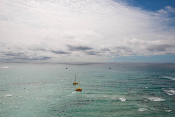 Two catamarans sailing off Waikiki beach