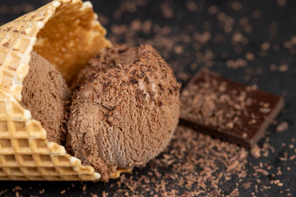 istock chocolate ice cream with chocolate chips on black slate 2195979562