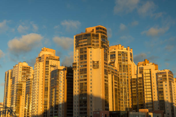 Russia, Saint Petersburg - January 18, 2025: Multi-storey buildings illuminated by the sun in a residential area