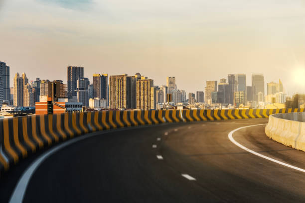 istock Curvy highway overpass with modern city background. 2195981634