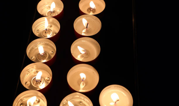 istock votive candles lit with flame and an empty space to insert a personalized text 2195981701