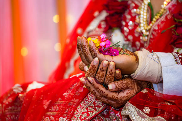 istock Indian couple's holding hands close up 2195984167