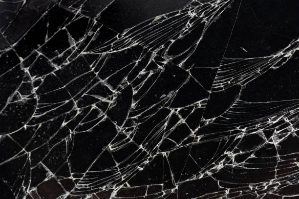 istock Shattered glass in dark background. 2195984766