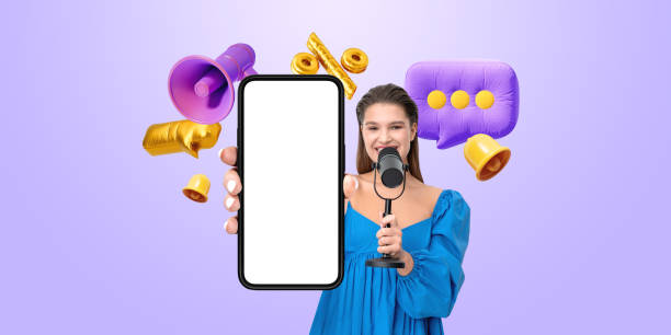 istock Woman holding smartphone with blank screen in hand while speakin 2195986720
