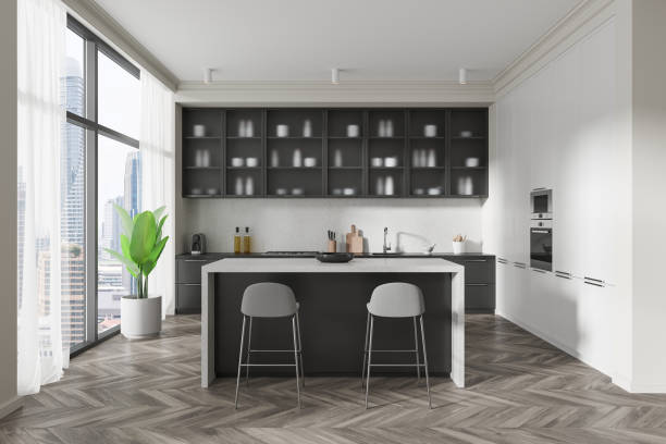 istock Modern kitchen interior with sleek cabinets, large windows, and minimalist design featuring a central island and barstools. 3D Rendering 2195986855