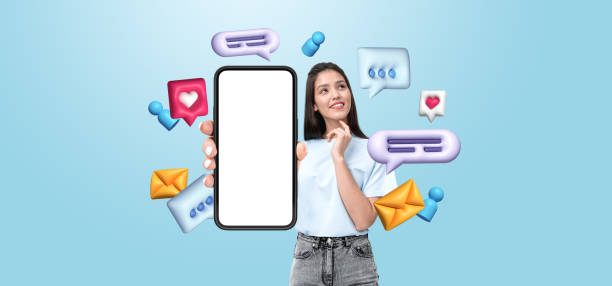 istock Woman holding smartphone with blank screen surrounded by colorfu 2195987087