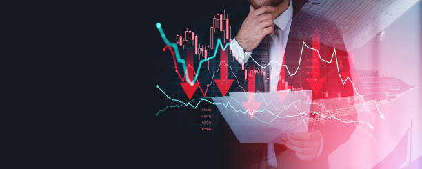 istock Businessman analyzing financial charts with falling graphs and r 2195987805
