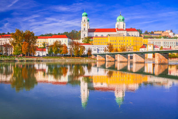 istock Passau, Germany. Waterfront dusk water reflection - old town cityscape with St. Stephan's Basilica and Inn River. 2195988404