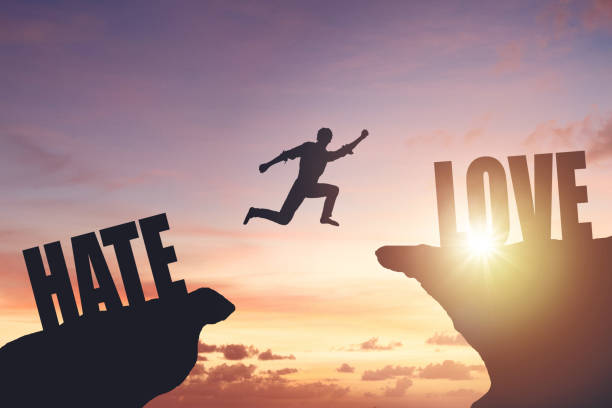 istock Silhouette of a man jumping from cliff to cliff 2195988534