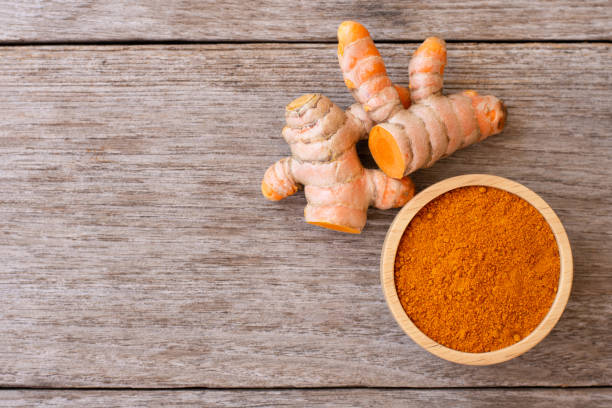 istock Turmeric powder and turmeric root 2195988881