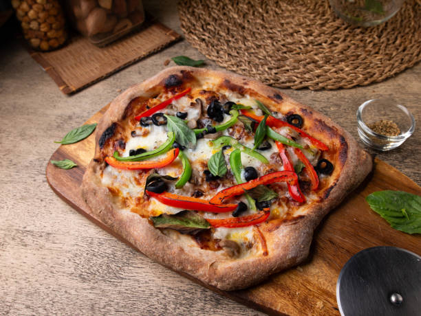 istock Homemade Sourdough pizza on Wooden Table. 2195989674