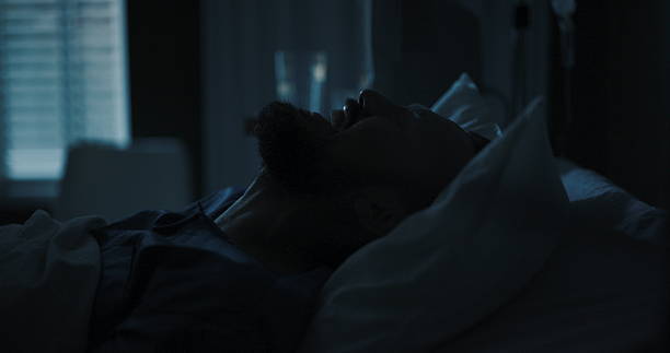 istock Man in a hospital room screams loudly, his cries echoing 2195991979