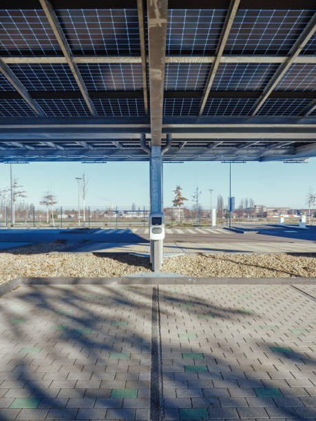 istock solar canopy at a charging station on an ev. parking lot 2195993800