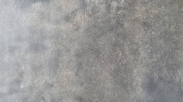 istock Old grey cement floor with cracks and stains. Black, grey and white grunge wall background. 2195994323