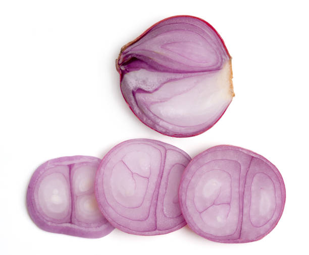 istock Top view fresh purple onion or shallot with cut slices on white background. 2195994753