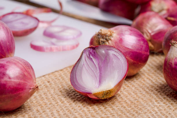 istock shallot or onion put on the cutting board. 2195994761
