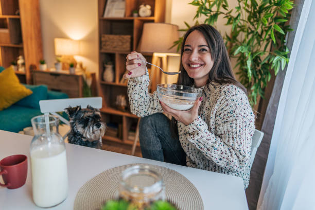 istock Woman eating muesli with milk. 2195994945