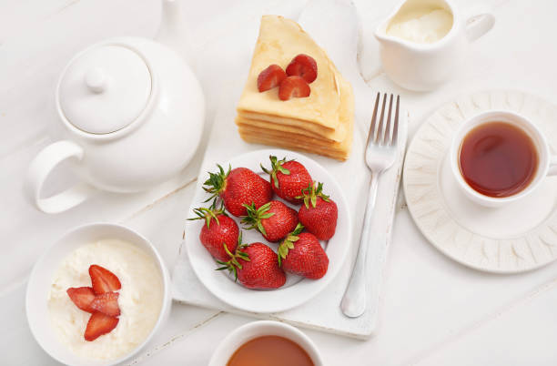 istock Strawberries and pancakes. Pancakes with strawberries. Romantic breakfast. Valentine's Day. Greeting Card Mother's Day. Breakfast in hotel room. Maslenitsa. Pancake week. Women's Day Congratulation 2195995823