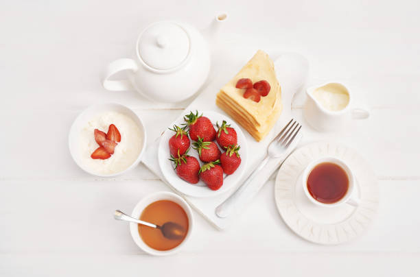 istock Strawberries and pancakes. Pancakes with strawberries. Romantic breakfast. Valentine's Day. Greeting Card Mother's Day. Breakfast in hotel room. Maslenitsa. Pancake week. Women's Day Congratulation 2195995831