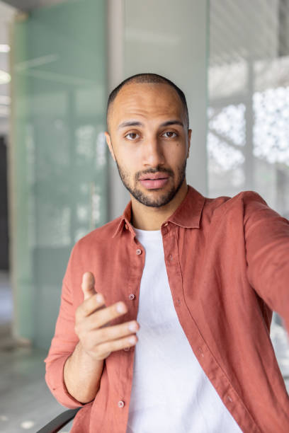 istock Confident man speaking during a professional video call from office 2196000175