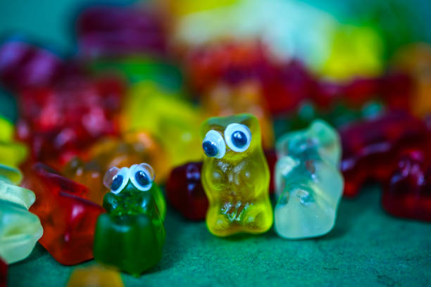 colorful gummy bears in a pile as a background,