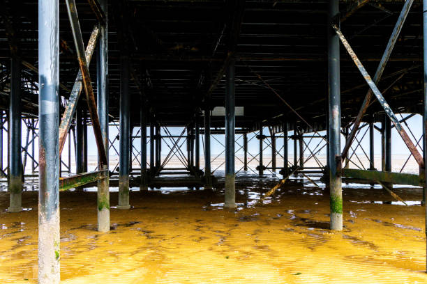A Typical British Beach View Of A Stunning Pier From One Of The UK's beaches. This location being Cleethorpes on the eastern coast.