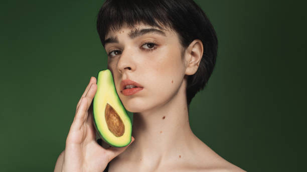 istock Woman with avocado 2196005106