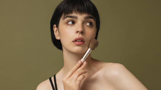 Woman with makeup brush
