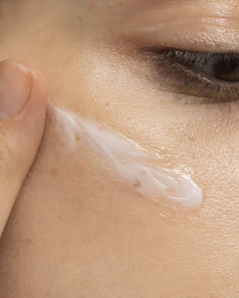 Cream on face. Skin care