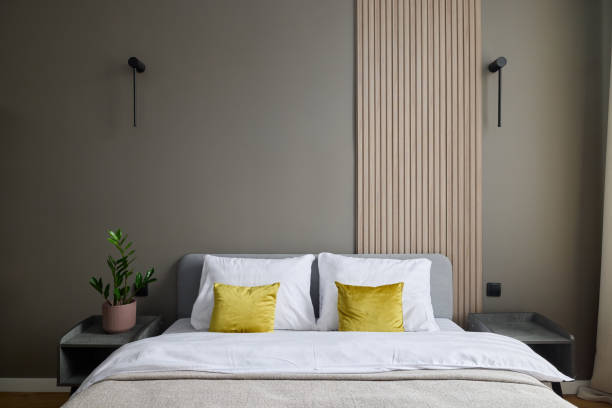 istock Explore a modern bedroom with a textured wall and elegant decor enhancing the aesthetics 2196005962