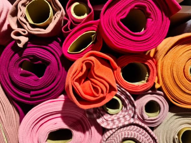 istock Colorful rolls of fabric showing different textures and colors, creating a vibrant display 2196007798