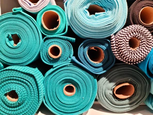 istock Colorful rolls of fabric forming a beautiful pattern are displayed in a fabric store 2196008500