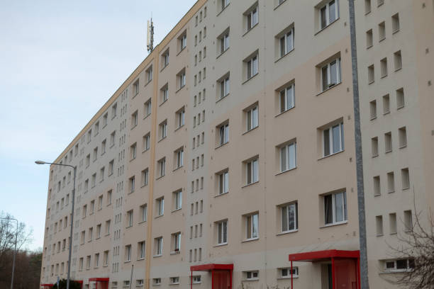 A Residential Building Featuring Windows and Striking Red Accents