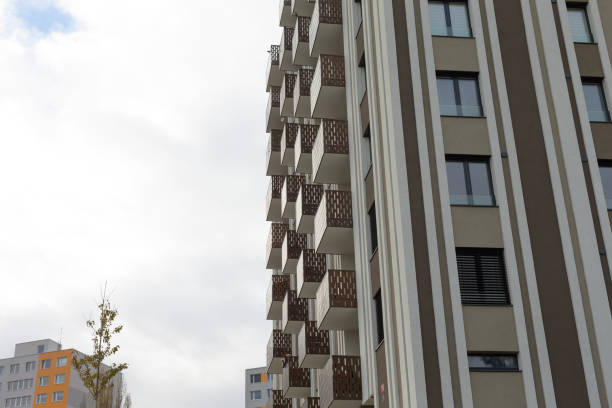 istock A very tall building that features many windows and numerous balconies 2196009103