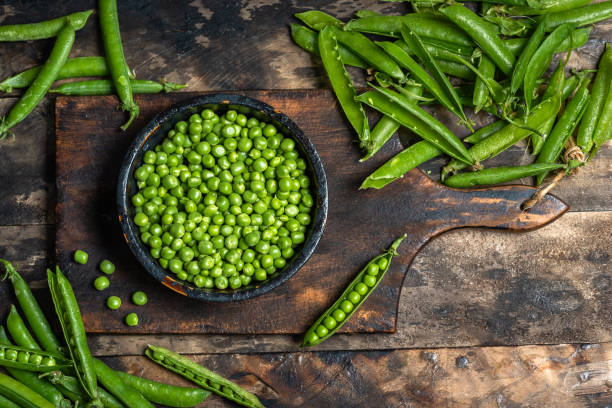 istock Bowl of Fresh Peas and Pods 2196009896