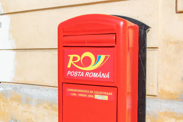 Letters with postage paid Australia stamps in a metal mailbox within industrial area in Sydney, Australia