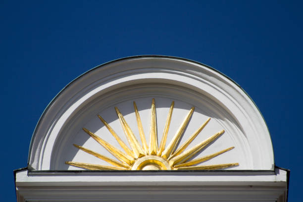 Detail of a sun decoration on a wallClassic week