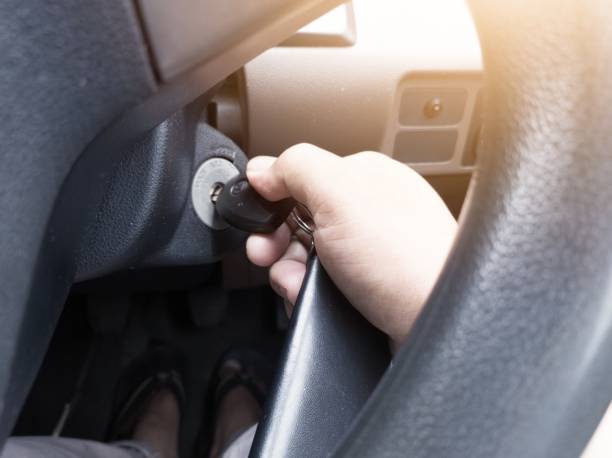 istock The concept of a driver starting a car engine using the ignition key. 2196011322
