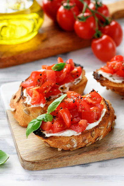 istock Cherry tomatoes and cream cheese bruschettas 2196011672