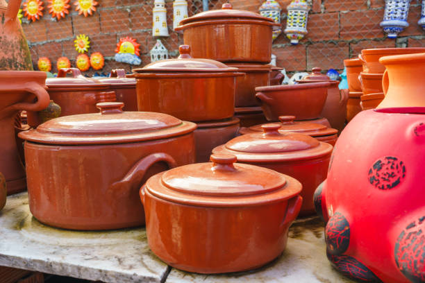 Beautifully glazed terracotta cookware adds a traditional touch to any kitchen.