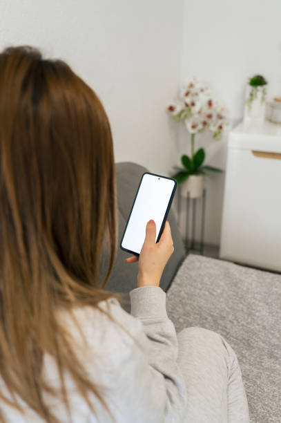 istock Woman Resting with Smartphone at Home 2196013971