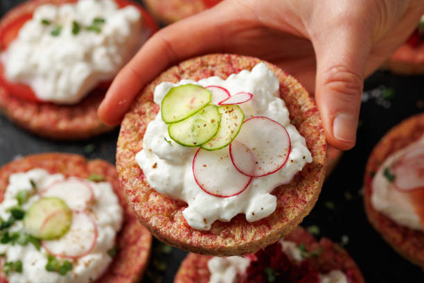 istock Lentil and pea protein veggie crispy cakes with cottage cheese, beetroot, tomatoes, radishes, cucumber and salmon 2196014778