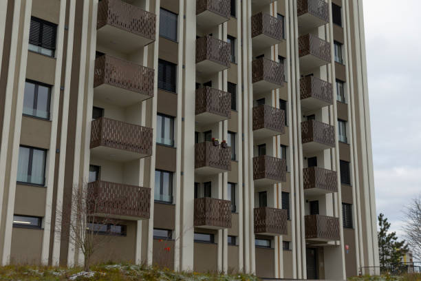 istock A very tall and modern building featuring numerous balconies and windows 2196014874