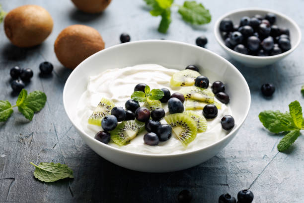 istock Greek yogurt with fresh blueberries and kiwi. Probiotic healthy breakfast 2196016436