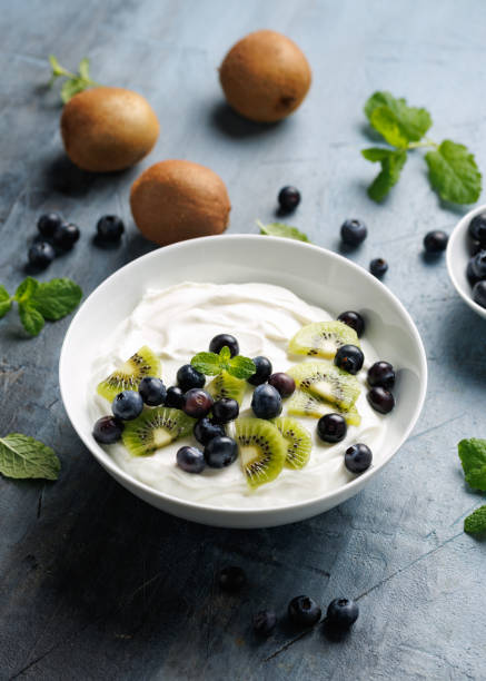 istock Greek yogurt with fresh blueberries and kiwi. Probiotic healthy breakfast 2196016450