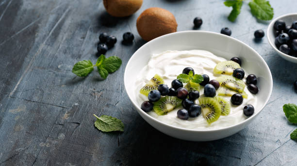 istock Greek yogurt with fresh blueberries and kiwi. Probiotic healthy breakfast 2196016471