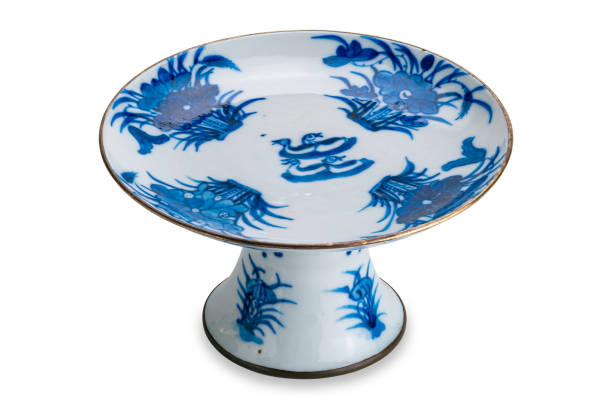 High angle view of ancient blue pattern chinese ceramic footed tray isolated on white background.