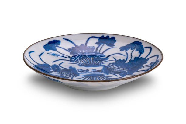 istock Closeup view of old blue pattern chinese ceramic plate isolated on white background. 2196021985