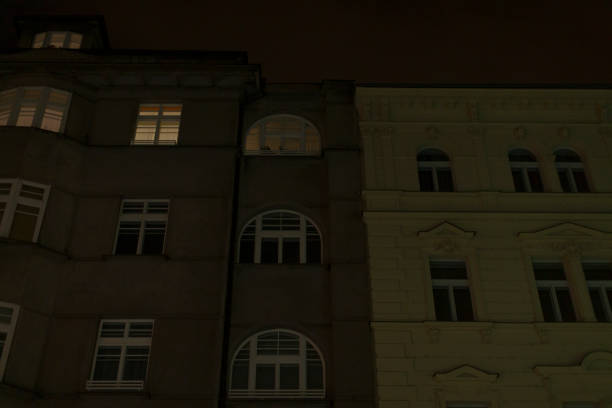 istock Urban architecture at night featuring buildings with illuminated windows 2196022701